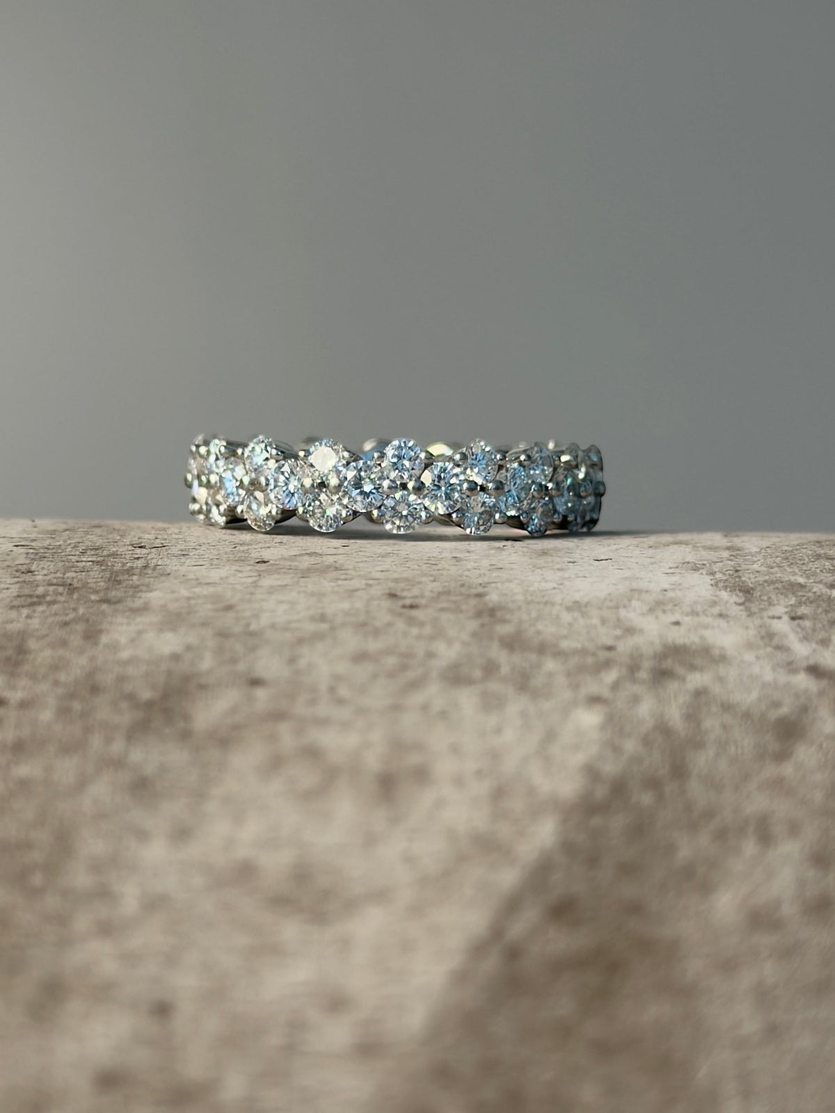 PAIGEAVERI white gold hinged eternity ring with brilliant-cut diamonds, featuring a unique clamshell opening for a secure fit.
