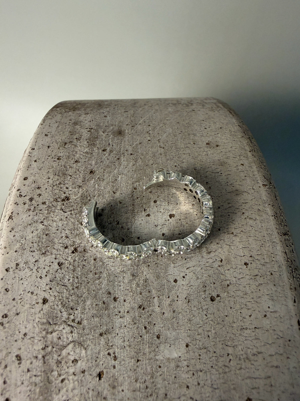 PAIGEAVERI white gold hinged eternity ring with brilliant-cut diamonds, featuring a unique clamshell opening for a secure fit.